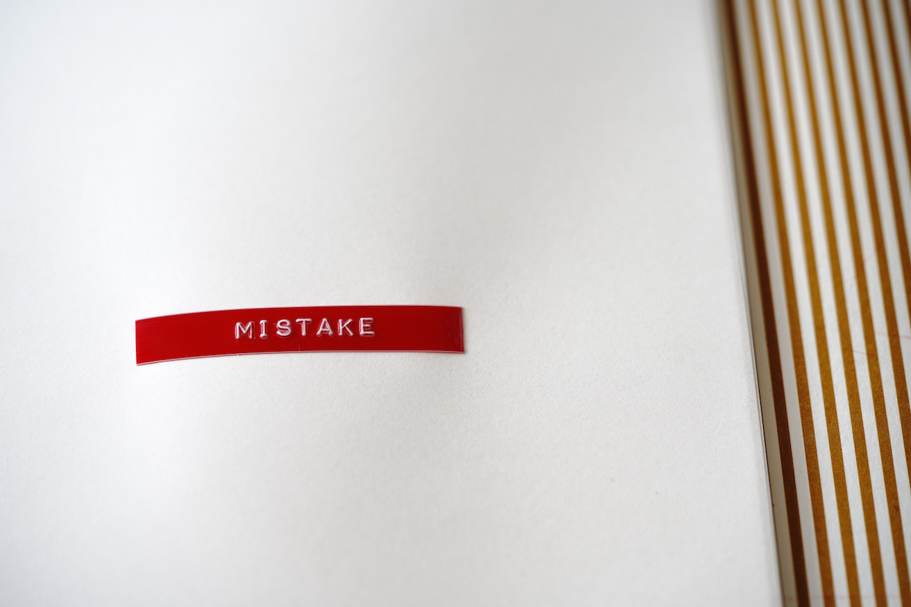 Word "mistake" in red on white background